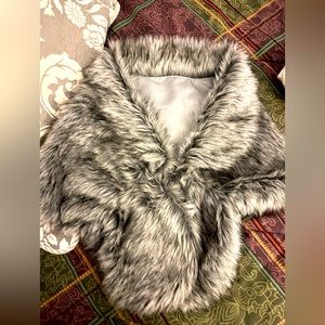 Black and gray faux fur wrap. Clasp closure. Perfect for wedding. New with tags